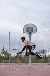 Teenager playing basketball - GRCF00063