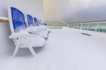 Cruise ship on an Arctic Winter voyage, fresh powder snow on decks, off Troms County, North Norway, Scandinavia, Europe - RHPLF13560