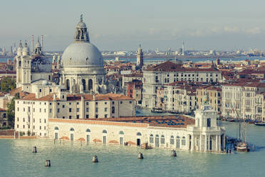 Punta della Dogana and Santa Maria della Salute standing at the meeting point of the Grand and Giudecca canals, Venice, UNESCO World Heritage Site, Veneto, Italy, Europe - RHPLF13644