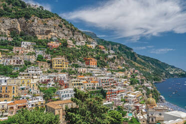 Sunny view of Positano low-rise buildings with church and cliffs, Positano, Costiera Amalfitana (Amalfi Coast), UNESCO World Heritage Site, Campania, Italy, Europe - RHPLF13676