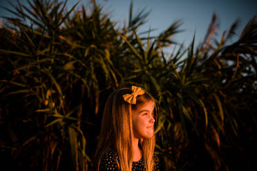 Young Girl Looking Off During Sunset - CAVF72755