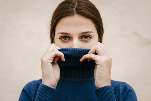 Close up portrait of woman with blue turtleneck pullover - TCEF00012