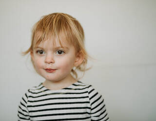 Portrait of toddler against white background - CAVF72994