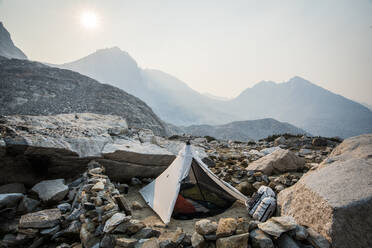 Tent set up on rocky mountainside - CAVF73120