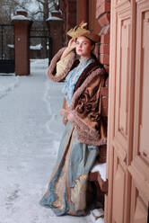 Beautiful Russian woman in a vintage dress. Russian village. Winter. - CAVF73225