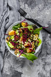 Winter salad with lettuce, tangerines, walnuts, feta and pomegranate seeds - SARF04426