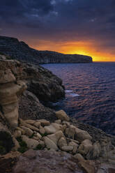 Malta, Rocky shore of Mediterranean Sea at sunrise - ABOF00509