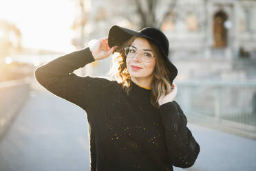 Portrait of young woman wearing hat - JOHF05292