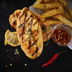 Grilled chicken breasts with French fries - DREF00034