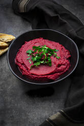 Bowl of beetroot hummus - LVF08540