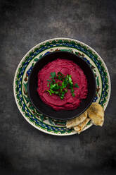 Bowl of beetroot hummus - LVF08541