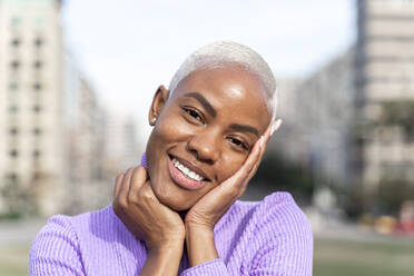 Portrait of smiling white haired woman in the city - AFVF05031