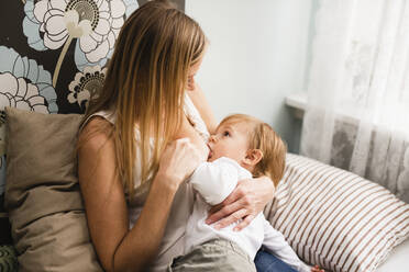 Mother breastfeeding son - JOHF05619