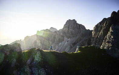 Man running on mounitain ridge at Axamer Lizum, Austria - CVF01541