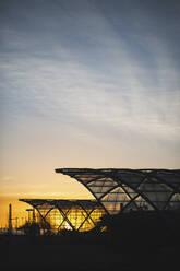 Germany, Hamburg, Silhouette of Elbbrucken station at sunrise - ASCF01065