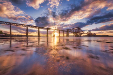 UK, Scotland, South Queensferry, Forth Bridge at dramatic sunset - SMAF01725