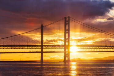 UK, Scotland, South Queensferry, Forth Road Bridge and Queensferry Crossing at dramatic sunset - SMAF01727