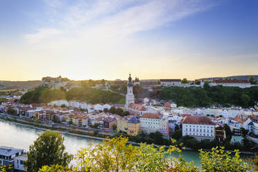 Germany, Bavaria, Burghausen, Riverside town at sunset - SIEF09434