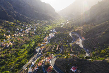 Spain, Canary Islands, La Gomera, Valle Gran Rey, El Retamal, Aerial view of towns and roads in mountain landscape - SIEF09439