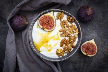 Bowl of Greek yogurt with honey, walnuts and sliced fig - LVF08562