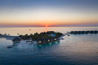 Maldives, South Male Atoll, Aerial view of lagoon of the Maldives island of Maadhoo at sunset - AMF07776