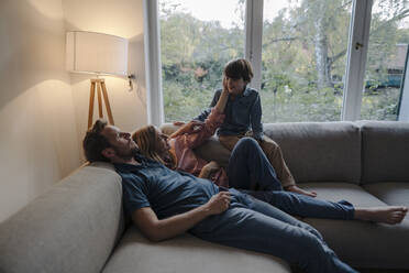 Happy family relaxing on couch - KNSF07272