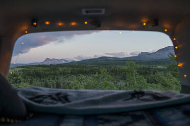 Scenic view of Glacier National Park seen through sports utility vehicle - CAVF73563