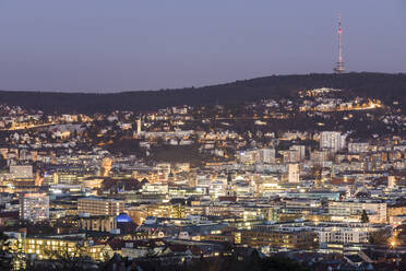 Germany, Baden-Wurttemberg, Stuttgart, Illuminated city downtown at dusk - WDF05691