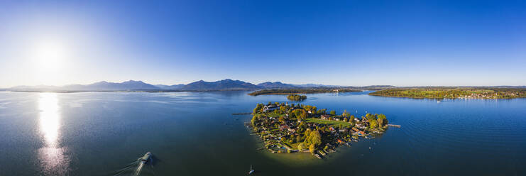 Germany, Bavaria, Aerial panorama of sun shining over Frauenchiemsee islet - SIEF09454