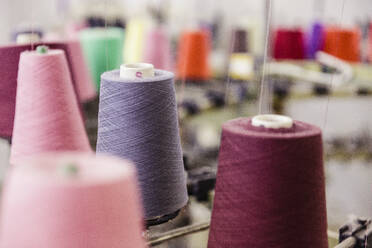 Detail of multicolored cotton reels in a factory - SDAHF00055