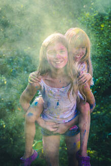 Portrait of two girls celebrating Festival of Colours - SARF04450