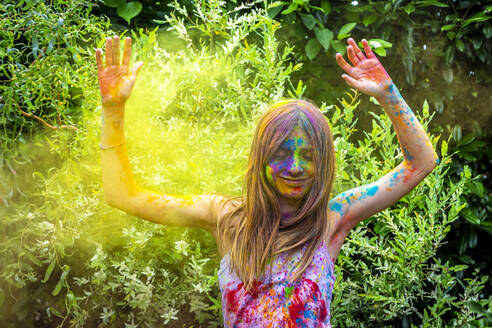 Portrait of happy girl celebrating Festival of Colours - SARF04458