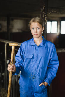 Young woman in cowshed - JOHF06435