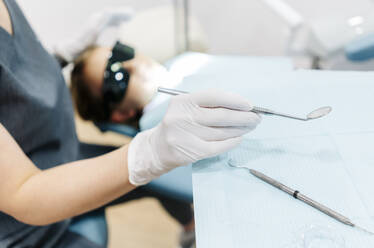 Girl at the dentist receiving treatment - DGOF00271