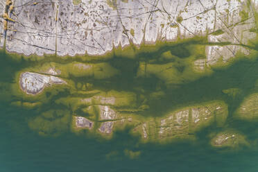 Aerial view of rock on sea coast - JOHF06862