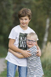 Boys posing in forest - JOHF06882