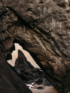 Rock formation through a keyhole on the Oregon coast - CAVF74069