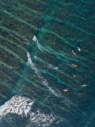 Aerial view of surfers in the ocean - CAVF74118