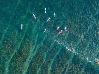 Aerial view of surfers in the ocean - CAVF74119