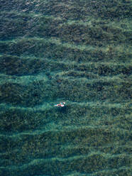 Aerial view of surfers in the ocean - CAVF74128