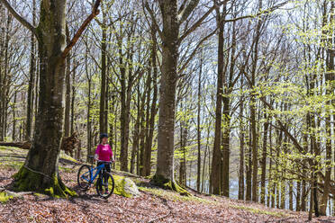 Cyclist in spring forest - JOHF07081