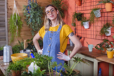 Portrait of confident young woman on her terrace - RTBF01409