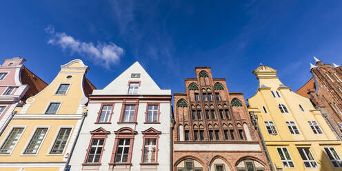 Germany, Mecklenburg-Western Pomerania, Stralsund, Low angle view of row of old town residential buildings - WDF05736