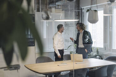 Two businessmen talking in office - KNSF07435