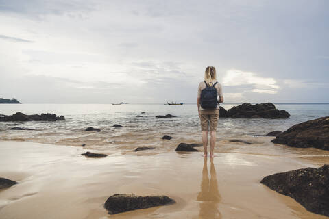 Rear view of woman on the beach Nai Thon Beach, Phuket, Thailand stock photo