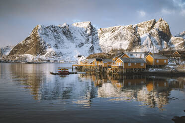Norway, Moskenes, Lofoten Islands, Sakrisoy, Fishing village at sunrise in Winter - JRAF00015