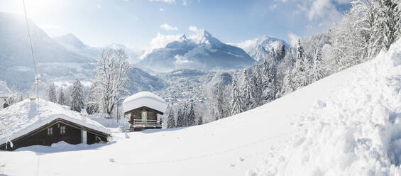 Germany, Bavaria, Berchtesgaden, Mountain hut and Watzmann in deep snow - JRAF00019