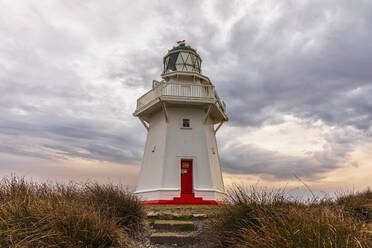 New Zealand, Oceania, South Island, Southland, Otara, Waipapa Point Lighthouse at sunset - FOF11788