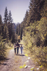 Mother hiking with daughters in the mountains - DHEF00111