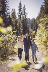 Mother hiking with daughters in the mountains - DHEF00113